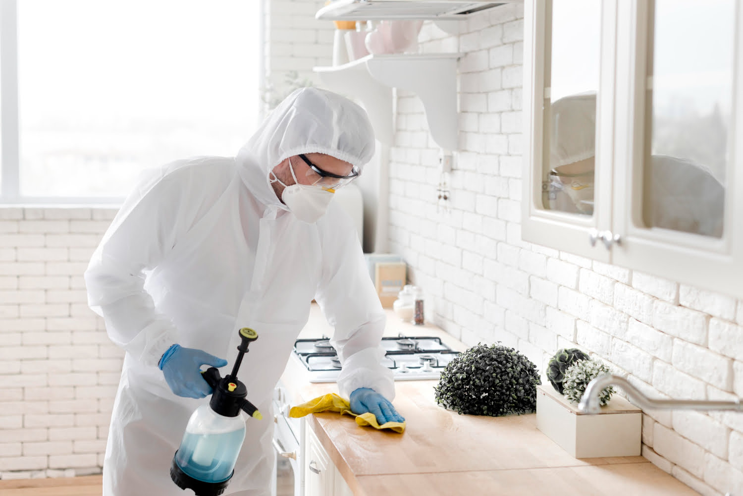 A professional pest control technician preparing equipment for a pest inspection.
